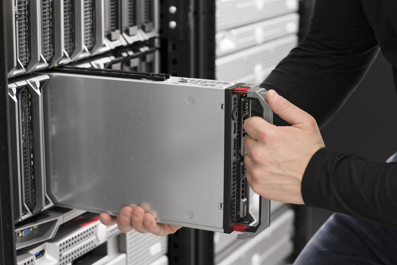 IT Engineer insert a Blade Server in Data Center.